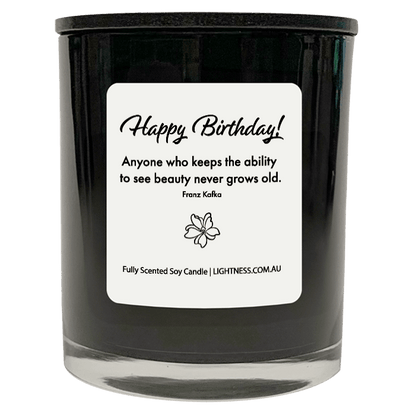 Candle in black glass jar with Birthday quote - Anyone who keeps the ability to see beauty never grows old.