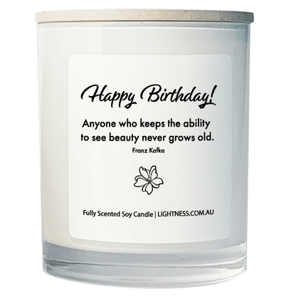 Candle in white glass jar with Birthday quote - Anyone who keeps the ability to see beauty never grows old.