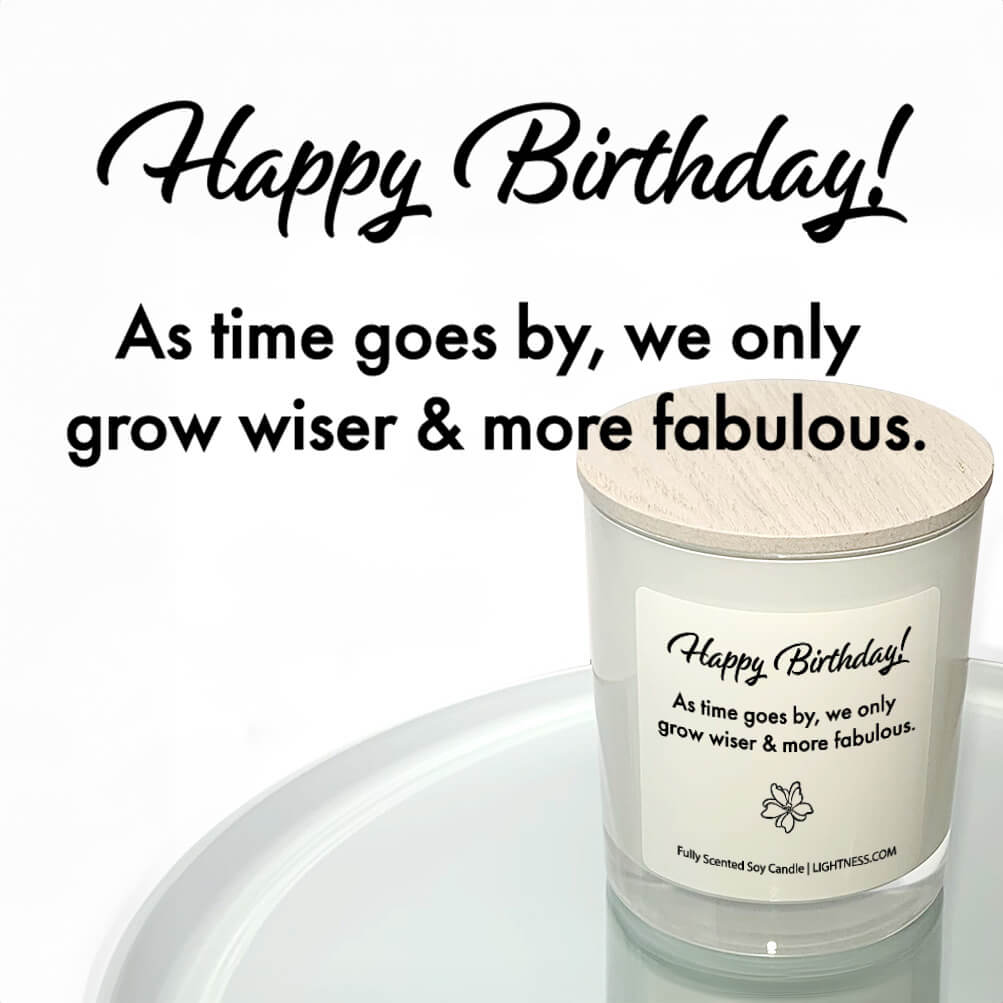 Candle in white glass jar reflected in mirror with Birthday quote - As time goes by, we only grow wiser and more fabulous.