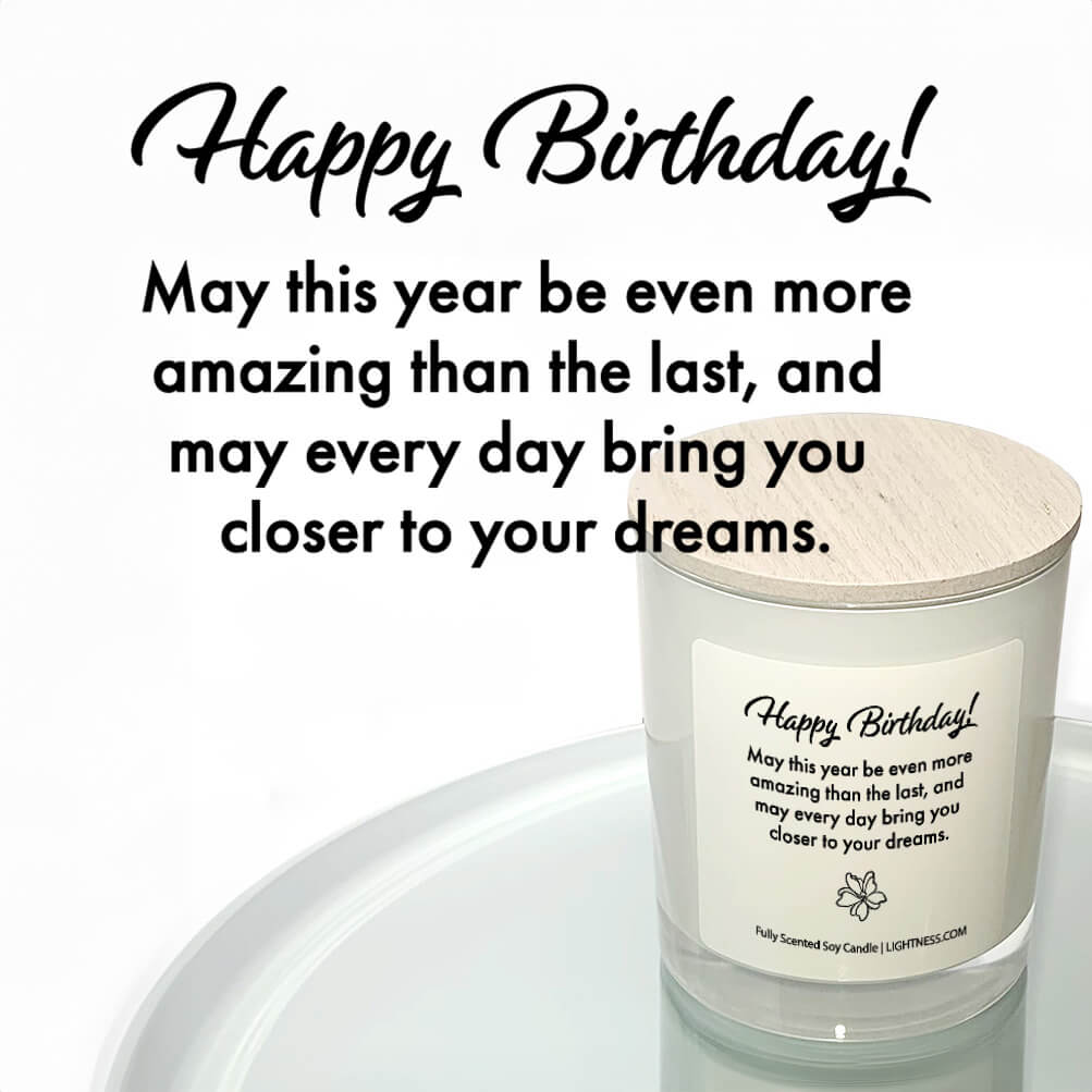 Candle in white glass jar reflected in mirror with Birthday quote - May this year be even more amazing than the last, and may every day bring you closer to your dreams.