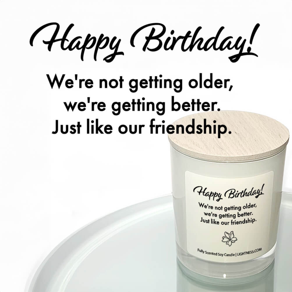 Candle in white glass jar reflected in mirror with Birthday quote - We're not getting older, we're getting better. Just like our friendship.