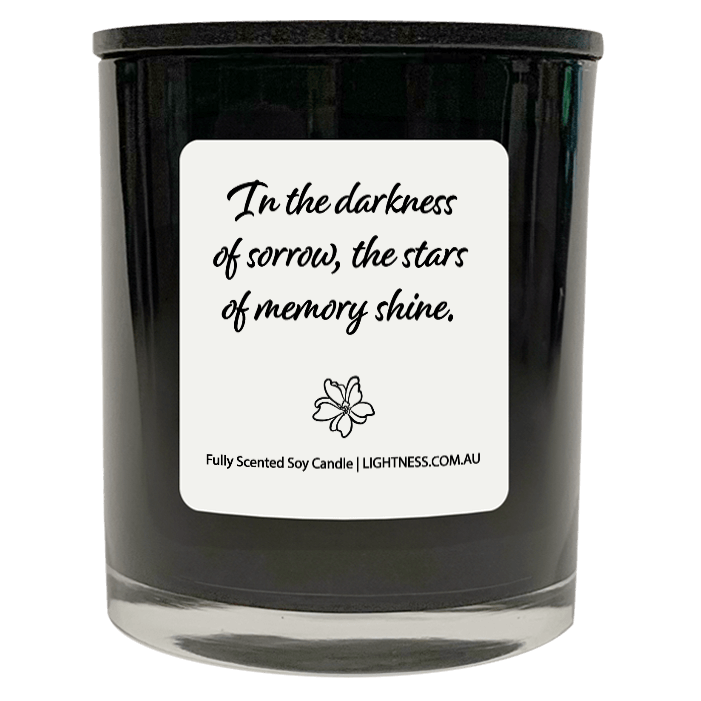 Candle in black glass jar with Condolence quote - In the darkness of sorrow, the stars of memory shine.