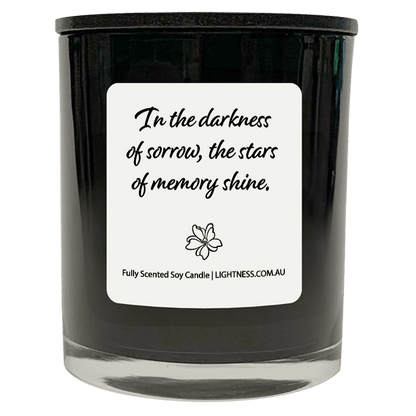 Candle in black glass jar with Condolence quote - In the darkness of sorrow, the stars of memory shine.