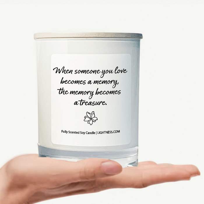 Candle in white glass jar on hand with Condolence quote - When someone you love becomes a memory, the memory becomes a treasure.