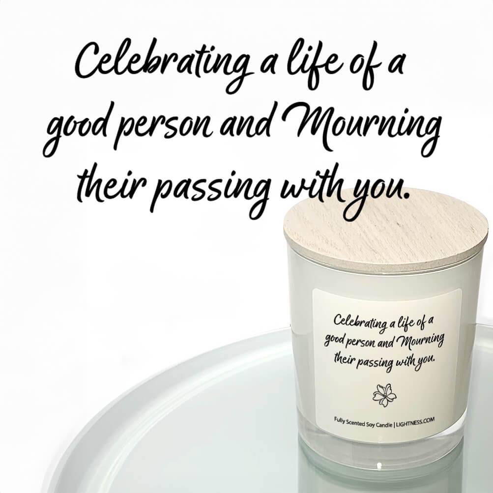 Candle in white glass jar reflected in mirror with Condolence quote - Celebrating a life of a good person and mourning their passing with you.