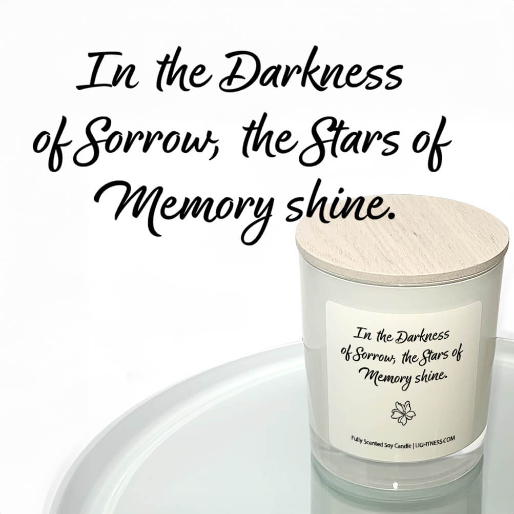 Candle in white glass jar reflected in mirror with Condolence quote - In the darkness of sorrow, the stars of memory shine.