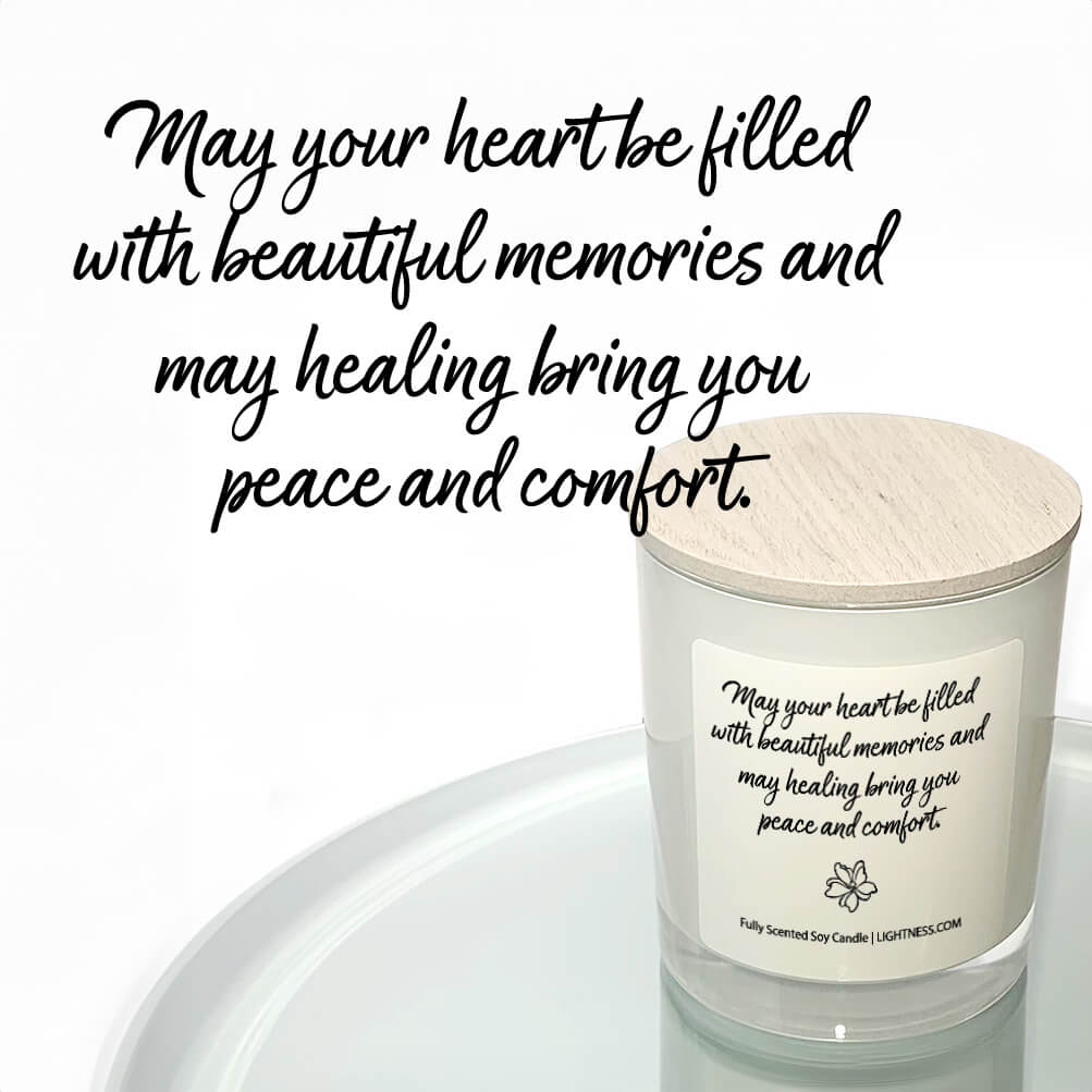 Candle in white glass jar reflected in mirror with Condolence quote - May your heart be filled with beautiful memories and may healing bring you peace and comfort.