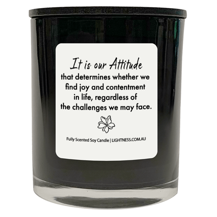 Candle in black glass jar with Happiness quote - It is our attitude that determines whether we find joy and contentment in life, regardless of the challenges we may face.