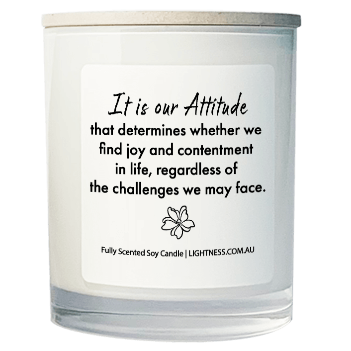 Candle in white glass jar with Happiness quote - It is our attitude that determines whether we find joy and contentment in life, regardless of the challenges we may face.