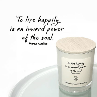 Candle in white glass jar reflected in mirror with Happiness quote - To live happily is an inward power of the soul.