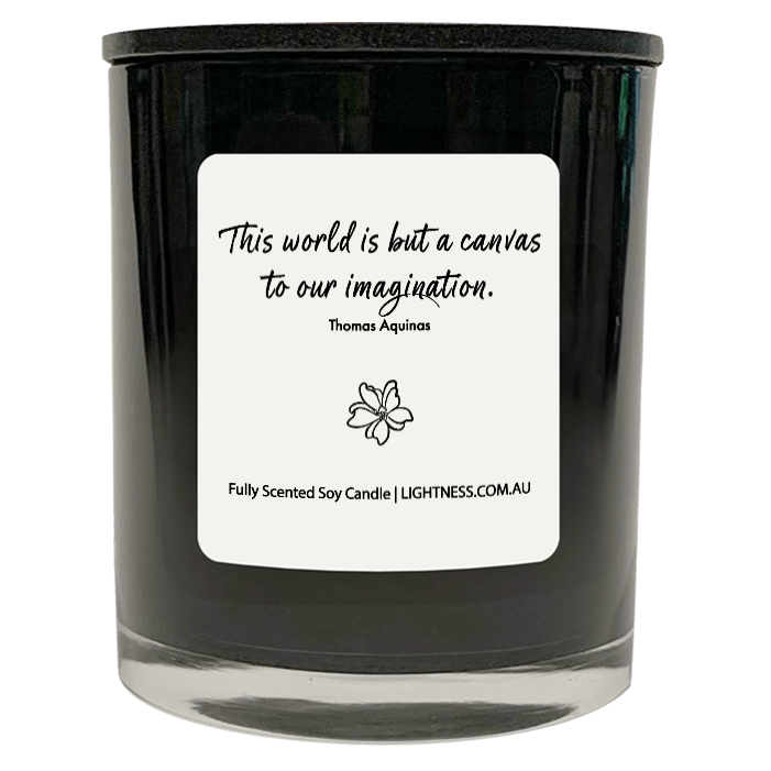 Candle in black glass jar with motivational quote - This world is but a canvas to our imagination.