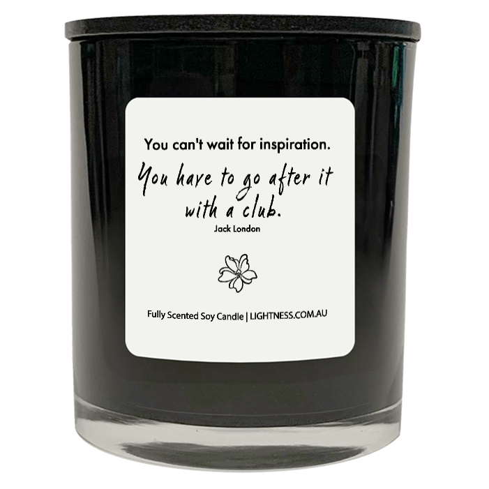 Candle in black glass jar with motivational quote - You can't wait for inspiration. You have to go after it with a club.