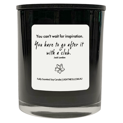 Candle in black glass jar with motivational quote - You can't wait for inspiration. You have to go after it with a club.