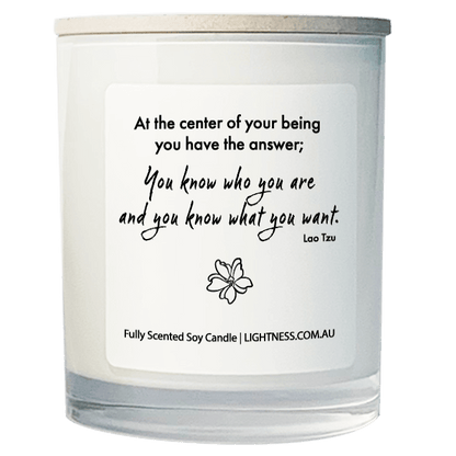 Candle in white glass jar with motivational quote - At the center of your being you have the answer; you know who you are and you know what you want.