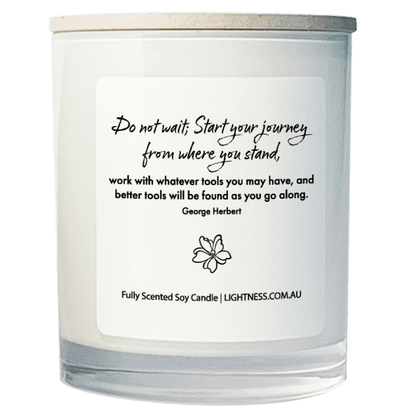 Candle in white glass jar with motivational quote - Do not wait; Start your journey from where you stand, work with whatever tools you may have, and better tools will be found as you go along.