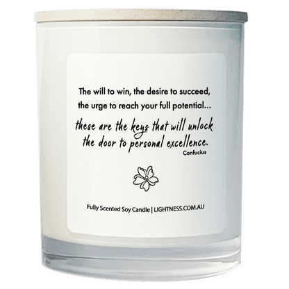 Candle in white glass jar with motivational quote - The will to win, the desire to succeed, the urge to reach your full potential... these are the keys that will unlock the door to personal excellence.