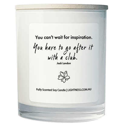 Candle in white glass jar with motivational quote - You can't wait for inspiration. You have to go after it with a club.