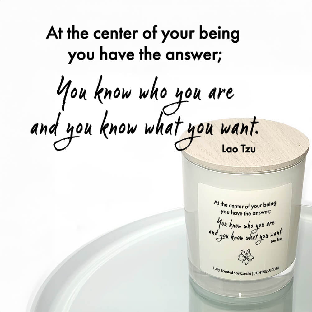 Candle in white glass jar reflected in mirror with motivational quote - At the center of your being you have the answer; you know who you are and you know what you want.