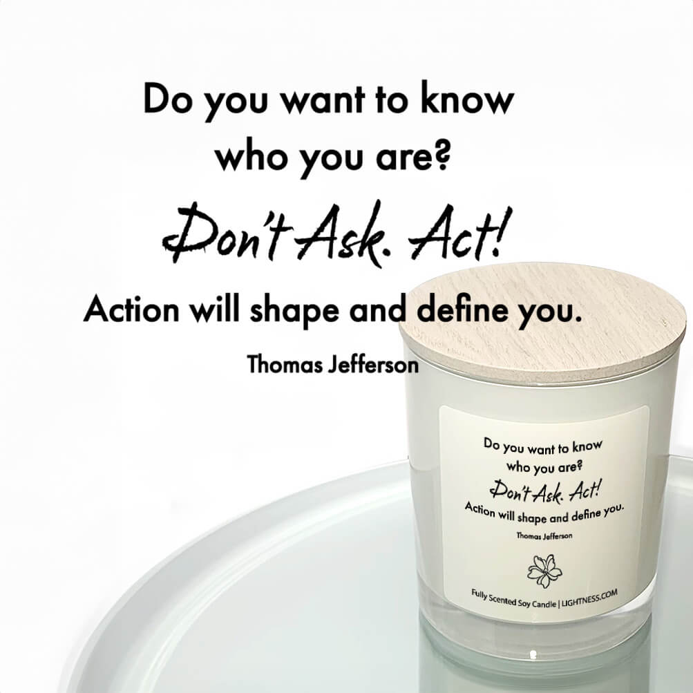 Candle in white glass jar reflected in mirror with motivational quote - Do you want to know who you are Don't ask. Act Action will shape and define you.