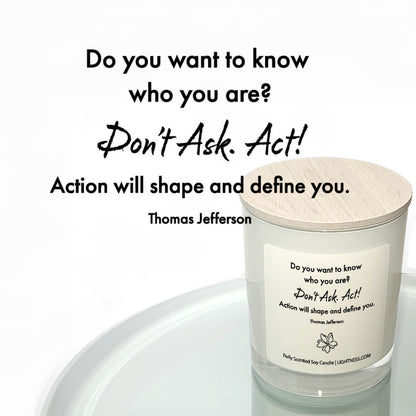 Candle in white glass jar reflected in mirror with motivational quote - Do you want to know who you are Don't ask. Act Action will shape and define you.