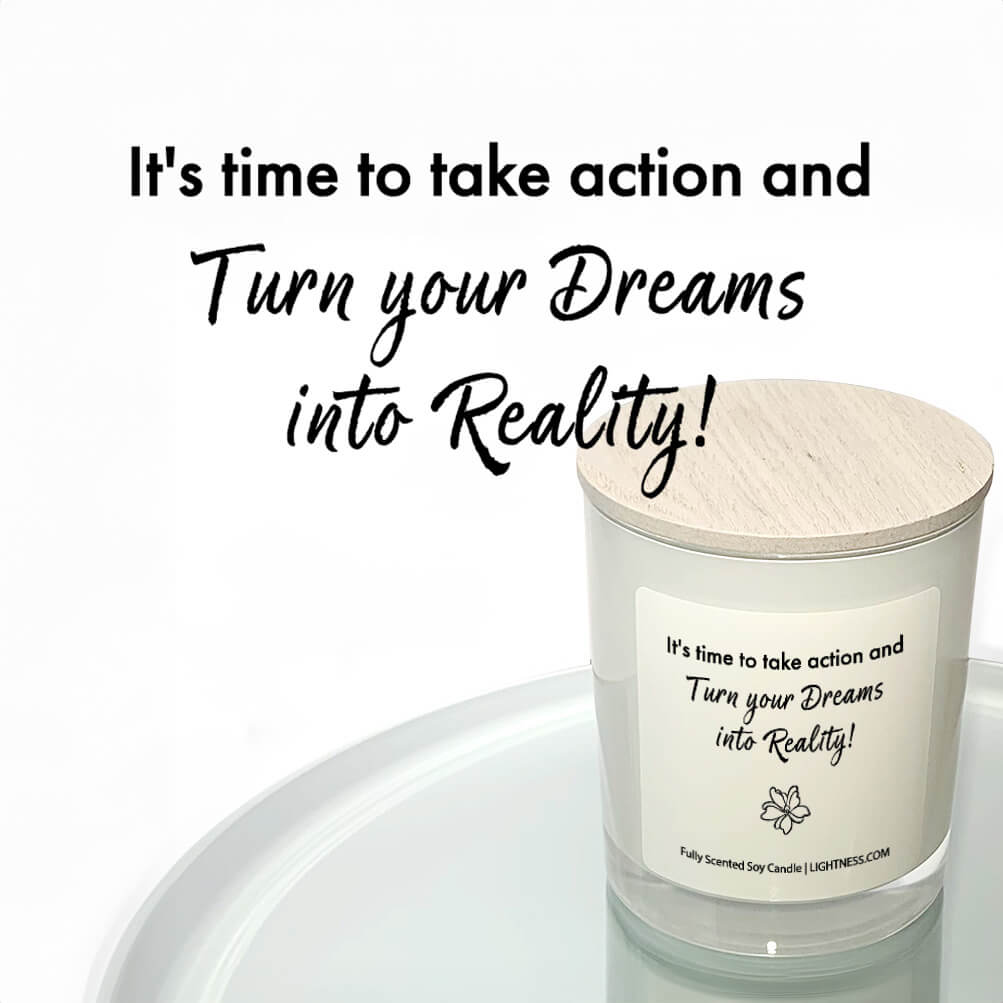 Candle in white glass jar reflected in mirror with motivational quote - t's time to take action and turn your dreams into reality!