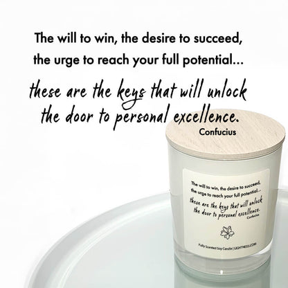 Candle in white glass jar reflected in mirror with motivational quote - The will to win, the desire to succeed, the urge to reach your full potential... these are the keys that will unlock the door to personal excellence.