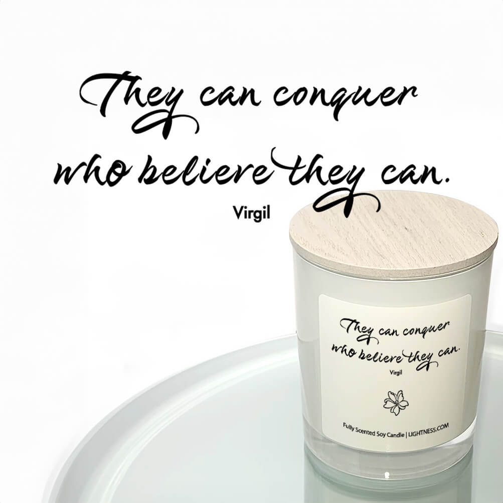 Candle in white glass jar reflected in mirror with motivational quote - They can conquer who believe they can.