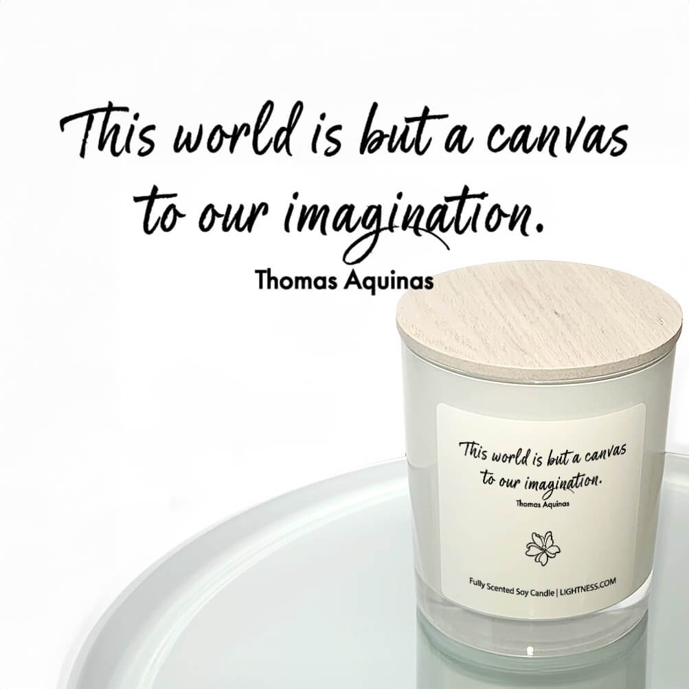 Candle in white glass jar reflected in mirror with motivational quote - This world is but a canvas to our imagination.