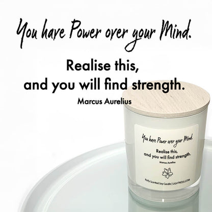 Candle in white glass jar reflected in mirror with motivational quote - You have power over your mind. Realise this, and you will find strength.