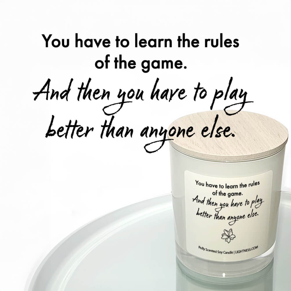 Candle from front and top with motivational quote - You have to learn the rules of the game. And then you have to play better than anyone else.